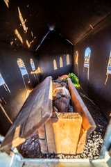 One baby death body in the ground at an old abandoned saltpeter people cemetery inside the Atacama Desert, loneliness to rest in peace in a remote location during the sunset hour. Taltal, Chile
