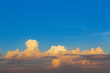 Beautiful big orange clouds on evening sky. Sunset