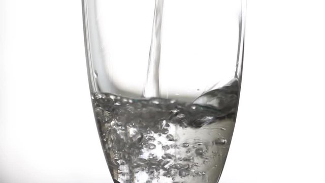 Serving water in a glass with white background