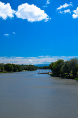 Fototapeta premium A view up the Rhone River taken from the Pont Saint-Benezet in Avignon, Provence, France