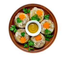 Aspic jellied meat with vegetables on plate top view isolated on white background