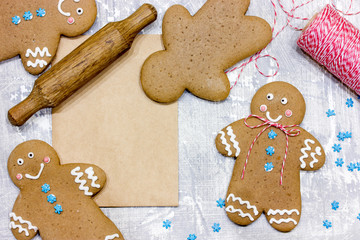 Christmas gingerbread man cookies decorated with icing for new year or christmas party, winter holiday, sweet homemade gift for kids