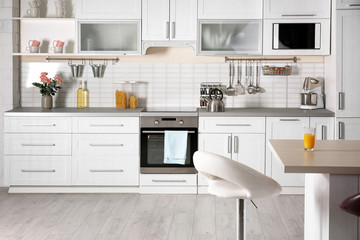 Light modern kitchen interior with new oven