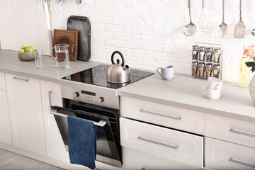 Light modern kitchen interior with new oven