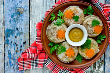 Jellied meat kholodets, meat aspic with vegetables and green parsley