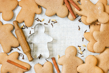 Christmas gingerbread man cookies with spices on white background