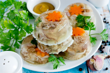 Jellied meat kholodets, meat aspic with vegetables and green parsley