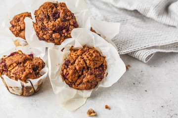 Healthy vegan berry muffins on a white background.