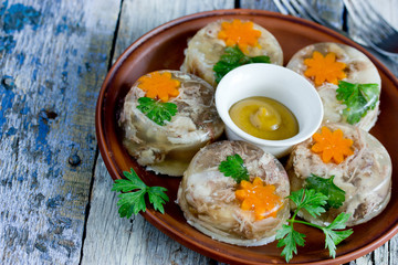 Jellied meat kholodets, meat aspic with vegetables and green parsley