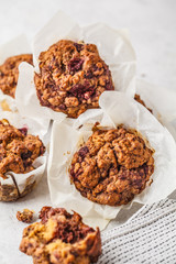 Healthy vegan berry muffins on a white background.