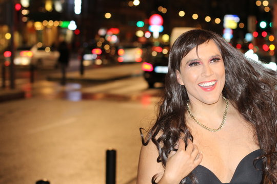Stunning transgender woman smiling outdoors 