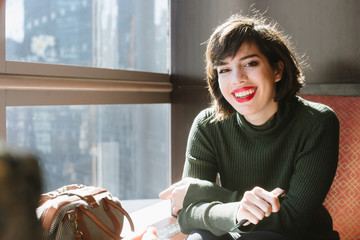 Businesswoman working in cafe