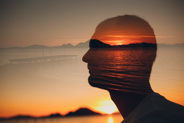 Man, sunset and sea. Psychotherapy concept. Multiple exposure. - obrazy, fototapety, plakaty