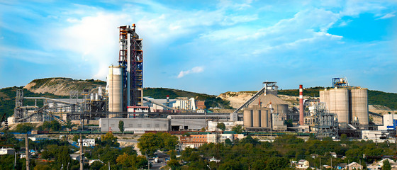 panorama of a cement plant in a sunny summer afternoon