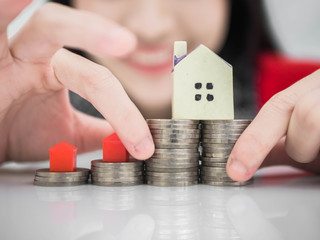 Mortgage concept by money house from the coins,Business Finance and Money concept,Saving concept to buy a house.