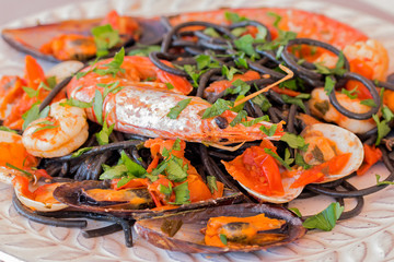 Black "spaghetti allo scoglio" with mussels, clams and king prawns.