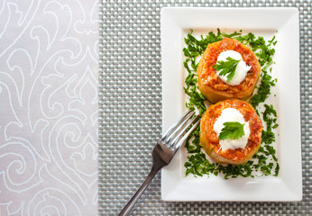 Zucchini stuffed with meat and vegetables