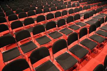 Free chairs in row in an empty auditorium