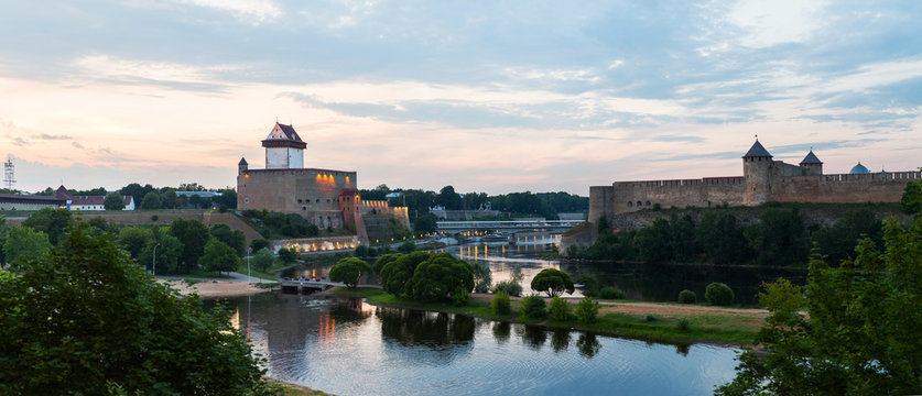 Panorama. Beautiful city landscape. Medieaval aged castle and river. Evening landscape, sunset
