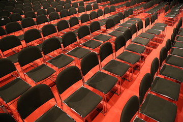 Naklejka premium Free chairs in row in an empty auditorium