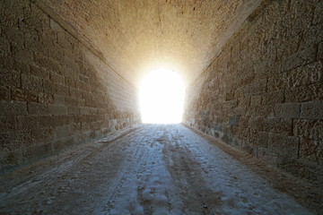 Inside a tunnel with bright light at the end, natural scene, L'Ametlla de Mar, Tarragona, Catalonia, Spain