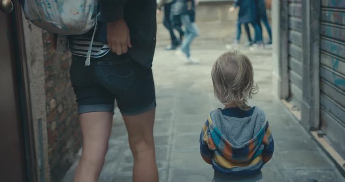 Mother and toddler walking in the city