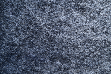 Dark grey felt material.Surface of felted fabric texture and abstract background.