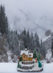 Naklejka premium decorative Christmas house on the background of the winter landscape