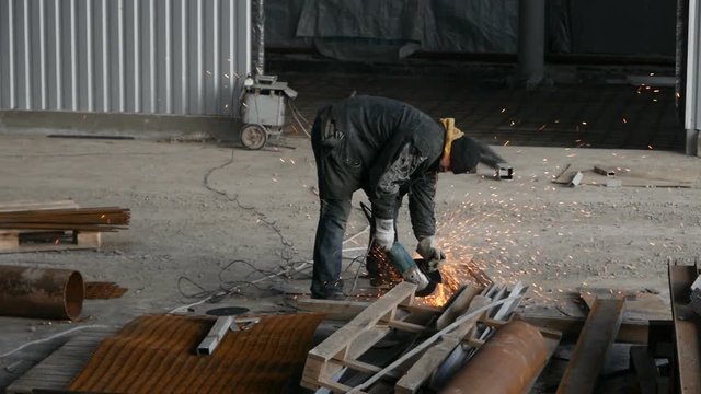 worker cutting steel bars of piling work