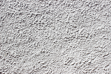 Light grey stucco decorated exterior wall texture background