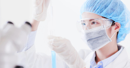 woman scientist take test tube