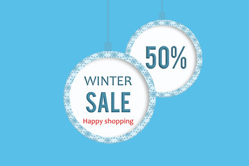 Winter sale 50 % in white blue christmas ball with snowflakes pattern. 
