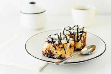 Cinnamon rolls with glaze on a plate. Fresh homemade cinnamon buns.