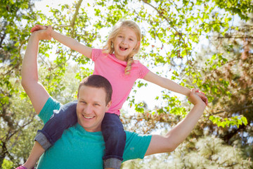 Cute Young Girl Rides Piggyback On Her Dads Shoulders