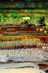 Colorful hanging beads, rosaries, different necklaces. Eastern market