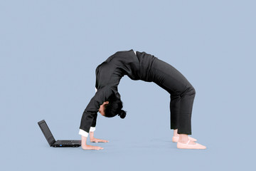 Entrepreneur uses a laptop with back bend pose