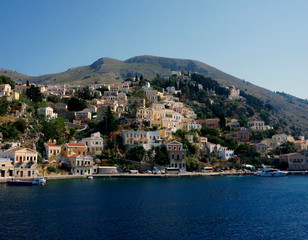 Fototapeta na wymiar houses in the hill sуmi island greece