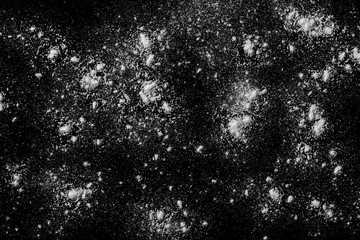 Pile of wheat flour isolated on black background, powder texture, top view with clipping path