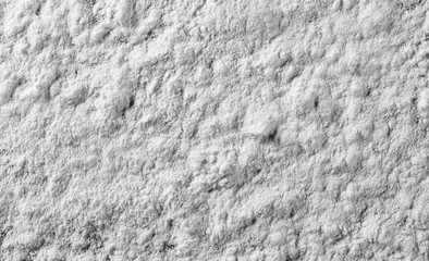 Pile of wheat flour background, powder texture, top view 