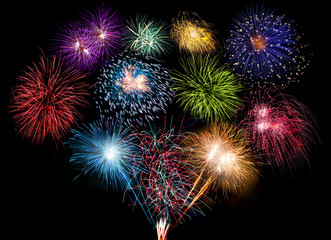 colorful fireworks display and bright sparkler pyrotechnic happy new year background