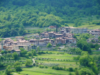 Tilt shift image of mountain village in italy