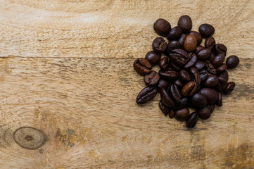 coffee bean pile on a  wooden background