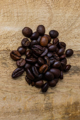 coffee bean pile on a  wooden background