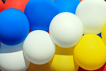 Bright blue,  white and yellow air balloons on a party . Balls background, aerostat.