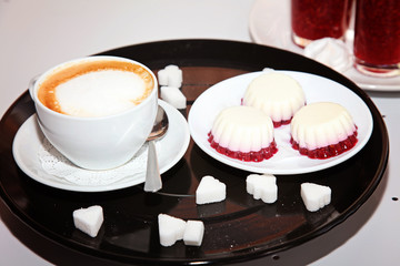 cozy interior of the cafe, where you can drink a Cup of cappuccino with a heart on the foam, eat a...