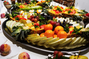 Modern desserts, cupcakes, sweets with fruits. Delicious candy bar.
