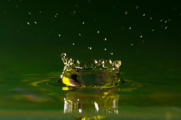 Drops of rain fall into the water, selective focus close-up