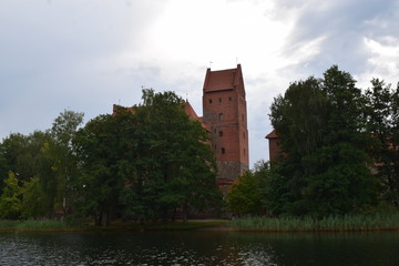 Fototapeta premium Trakai island castle at the lake. Reflection in water.