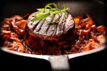 Fried pork chop with vegetable on wooden board
