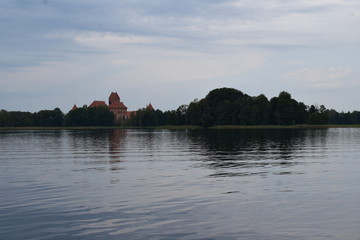 Obraz na płótnie Canvas Trakai island castle at the lake. Reflection in water.